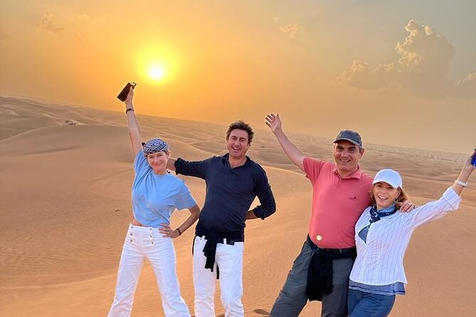 Dubai Desert Safari with Camel Ride, Sand surf, & BBQ Dinner - Crossing the red dunes by safari vehicle