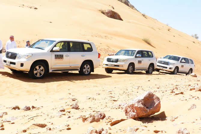 Dubai Desert Safari with Camel Ride, Show, BBQ and Transfers - Camp dinner under the stars