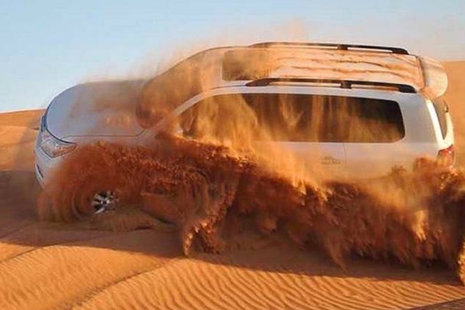 Dubai Desert Safari with Camel Riding, Sand Boarding,BBQ Dinner and 3 Live Shows - Sandboarding and the first desert activities