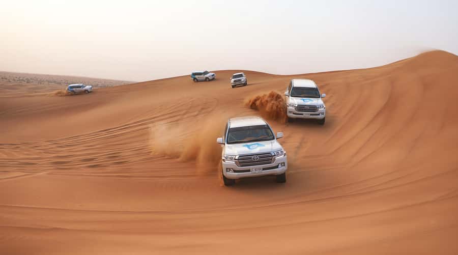 Dubai: Desert Safari with Camp, Dinner, & Optional Overnight - From Dubai hotels to the open sand