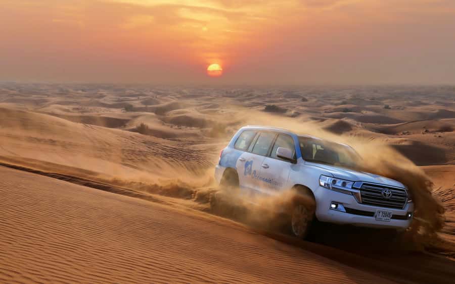 Dubai: Desert Safari with Camp, Dinner, & Optional Overnight - Sandboarding and the best photo stop