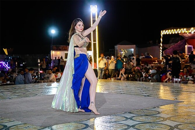 Dubai Desert Safari with Dinner, Camel Ride & Dune Bashing - Belly dance, tanura, and fire performances