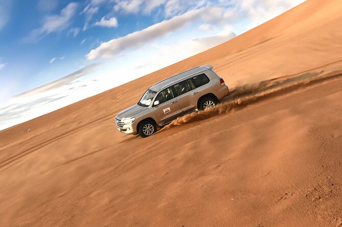 Dubai Desert Safari with Dune Bashing & Live Shows - Leaving Dubai for Al Lahbab’s red dunes