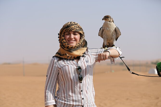 Dubai Desert Safari with Quad Bike, Dune Bashing, Camel Ride, Sand Boarding &BBQ - Camel riding and falcon photographs