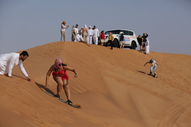 Dubai Desert Safari with Quad Bike, Dune Bashing, Camel Ride, Sand Boarding &BBQ - BBQ camp, drinks, and evening entertainment