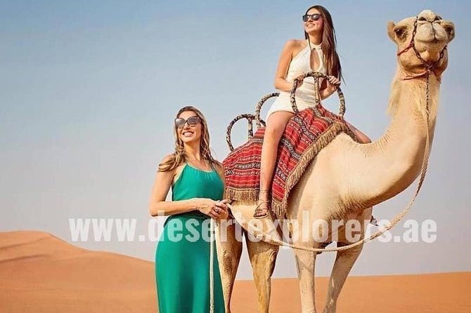 Dubai Desert Safari with Quad Bike, sandboarding, live show & BBQ - A short camel ride and the desert camp