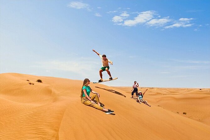 Dubai Desert Safari with Self Drive Quad Biking & Camel Riding - Camel riding and sandboarding