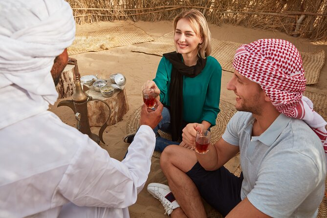 Dubai: Evening Camel Caravan, Bedouin Dinner at Al Marmoom Oasis - Arabic Dress and Falcon Photos