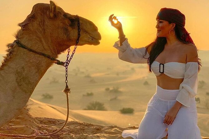 Dubai Evening Desert Safari & BBQ Dinner - Sandboarding and sunset on the dunes