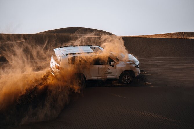 Dubai Evening Desert Safari: Sandboarding, BBQ, Camel Ride & more - From Dubai’s towers to open sand