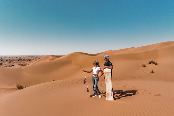 Dubai Evening Desert Safari: Sandboarding, BBQ, Camel Ride & more - Dune driving and the sunset stop
