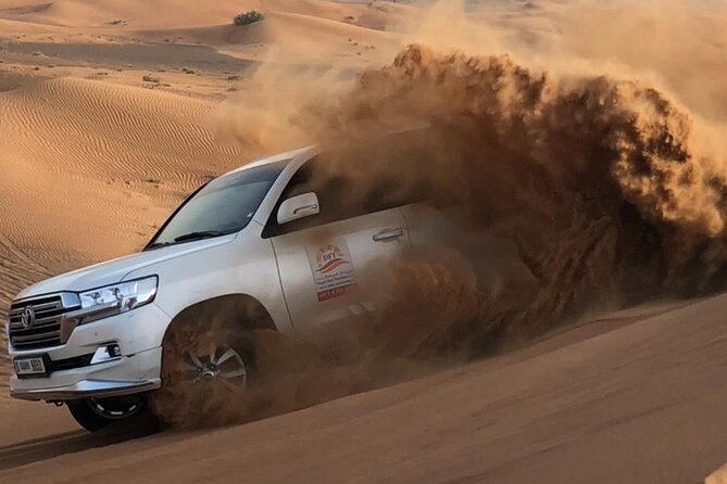 Dubai Evening Desert Safari with BBQ & Live Entertainment - Sandboarding on the dunes