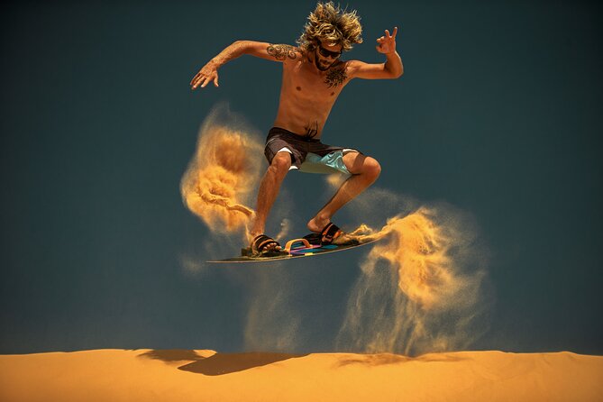 Dubai Evening Desert Safari with Thrilling Dune Buggy Adventure - Camel riding and sandboarding