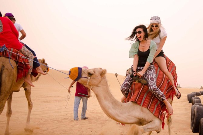 Dubai Evening4x4Desert Safari BBQ Dinner,4 Live Shows,Camel Ride - Arabian coffee, dates, and the Bedouin-style camp