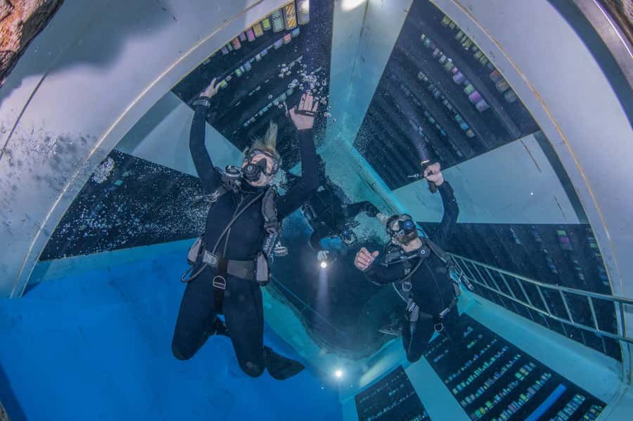 Dubai: Guided Scuba Dive for Certified divers at Deep Dive - Following the guide through the submerged city
