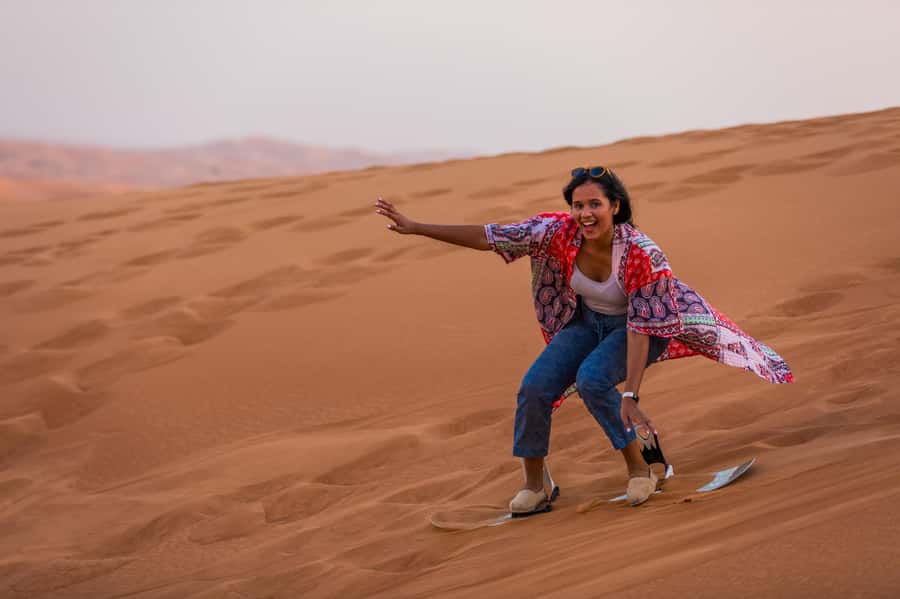 Dubai: Half-Day Desert Safari, Camel Ride, ATV & Dune Buggy - Sandboarding on soft red slopes