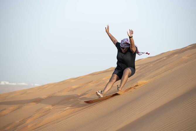 Dubai Half-day Red Dunes bashing with Sandboarding, Camel &Falcon - Falcons, Arabic dress, and henna