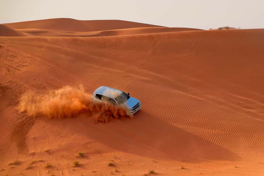Dubai: Helicopter Ride, Desert Safari, Camels & Refreshments - From Dubai pickup to the red dunes of Lahbab