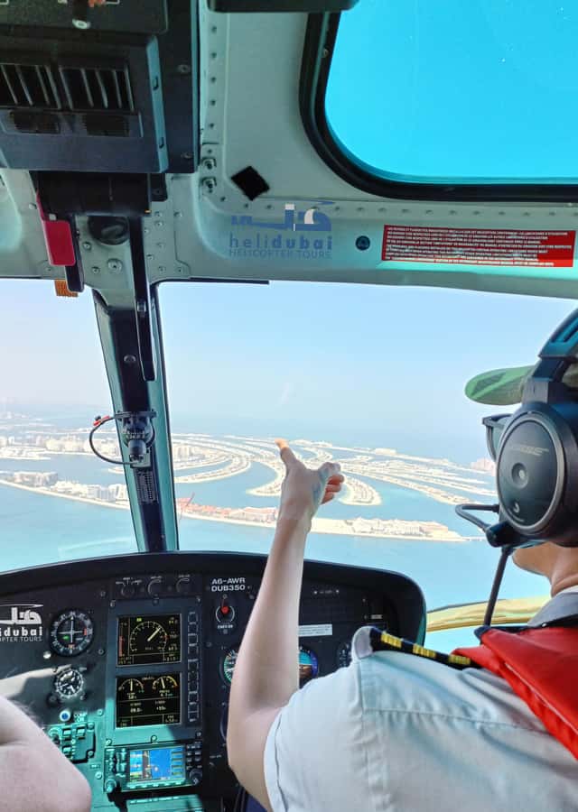 Dubai: Helicopter Ride, Old Town Walking Tour, Abra & Snacks - The 12-Minute Helicopter Flight Over Dubai