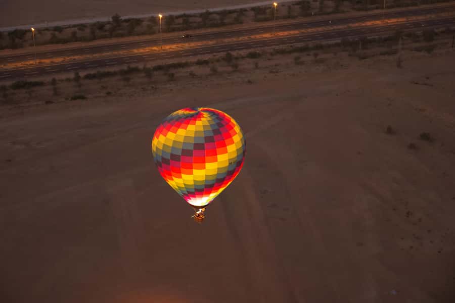 Dubai: Hot Air Balloon, Desert Safari, and Quad Biking Tour - Dune bashing across the red sand
