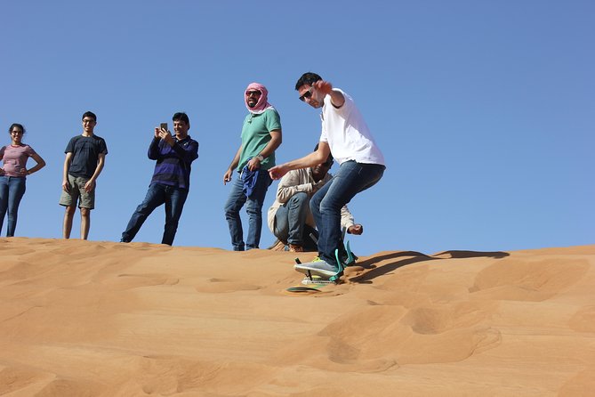 Dubai: Jeep Desert Safari, Camel Ride, and Quad Bike Tour - Sandboarding adds a simple second thrill