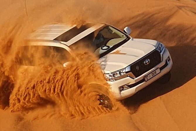 Dubai: Jeep Desert Safari, Camel Ride, and Quad Bike Tour - Al Aweer Camp, BBQ, and traditional entertainment