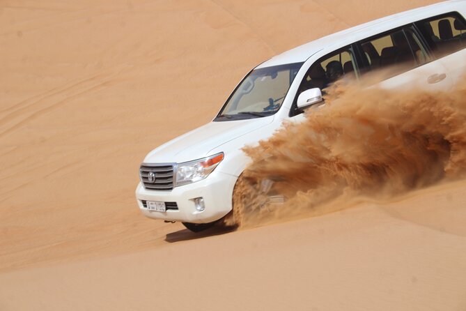 Dubai: Jeep Desert Safari, Camel Ride, and Quad Bike Tour - Guides, photos, and the human side of the tour