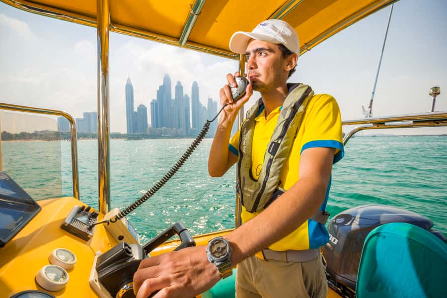 Dubai Marina: Guided Sightseeing Tour by Speedboat - The guide, captain, and photo stops