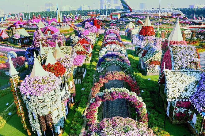 Dubai Miracle Garden and Global Village Shopping Tour - Transport, guides, and the human side of the tour