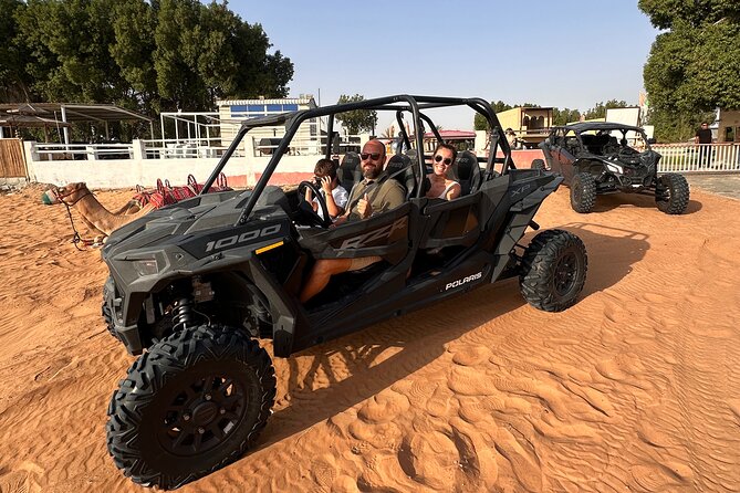 Dubai Morning 4 Seater Buggy Tour Sand Boarding & Camel ride - Sandboarding keeps the pace playful
