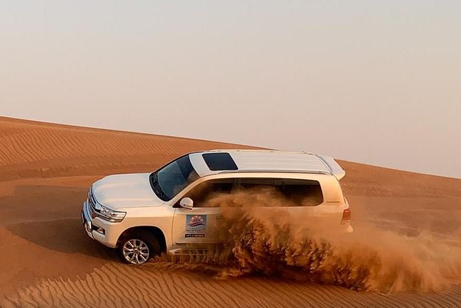 Dubai Morning Desert Safari: Camel Ride & Sandboarding! - Leaving Dubai in an air-conditioned 4x4