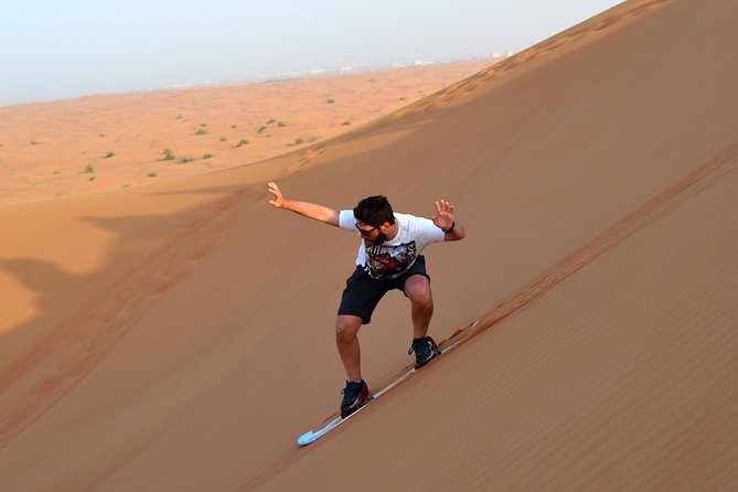 Dubai Morning Quad Bike with Sandboarding and Camel Ride - From Dubai towers to open sand
