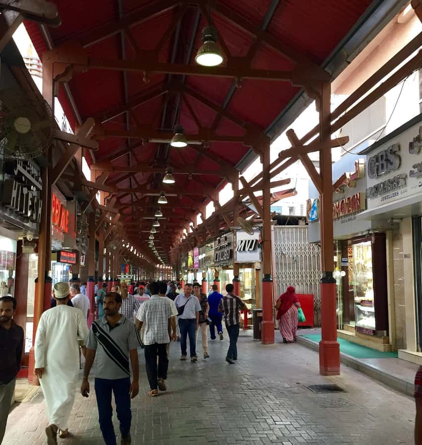 Dubai: Old City Walking Tour with Abra Ride - The textile market keeps the old commercial story alive