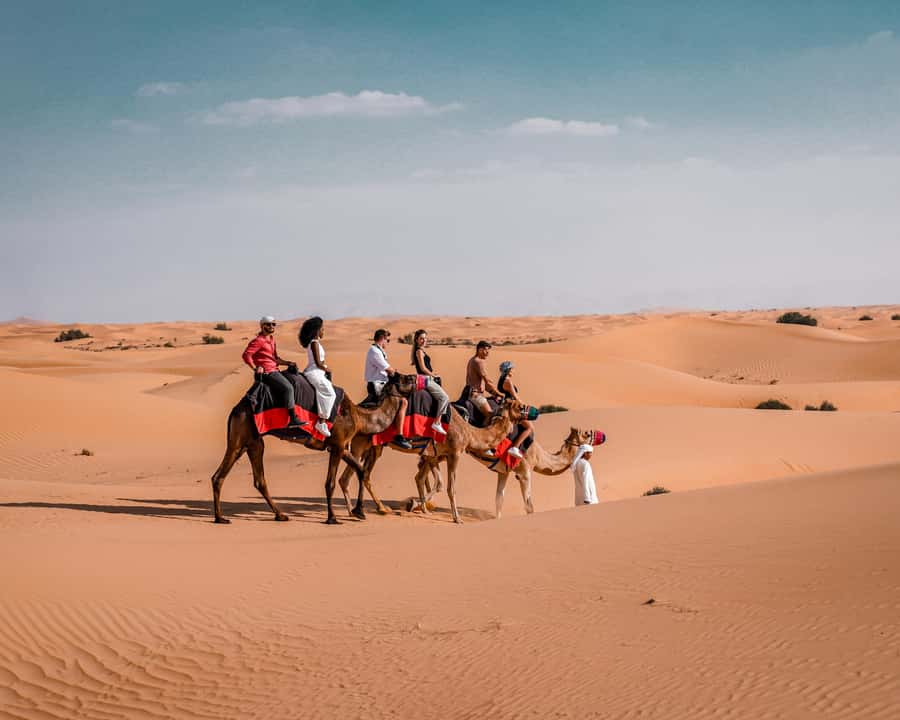Dubai: Premium Desert Safari, Camel Ride, BBQ & Sandboarding - Sunset drinks and the best photo stop
