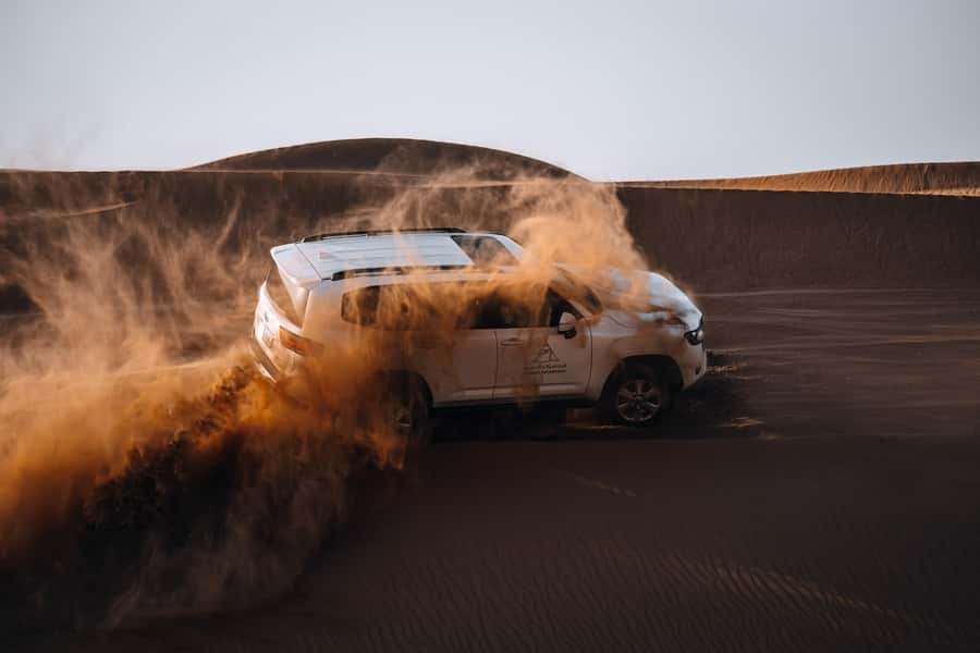 Dubai: Premium Desert Safari, Camel Ride, BBQ & Sandboarding - Hotel pickup and the ride toward Fort Lisaili