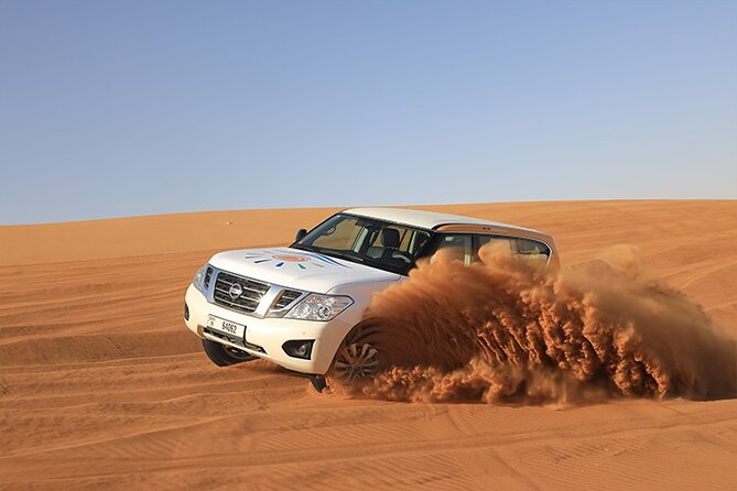 Dubai Premium Desert Safari with Live shows & Gourmet Dinner - Thirty minutes of dune bashing and a sunset stop