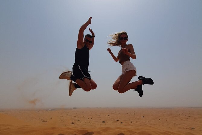 Dubai Premium Red Dunes Safari Camel Ride and BBQ Dinner - Red dunes, sandboarding, and sunset photos