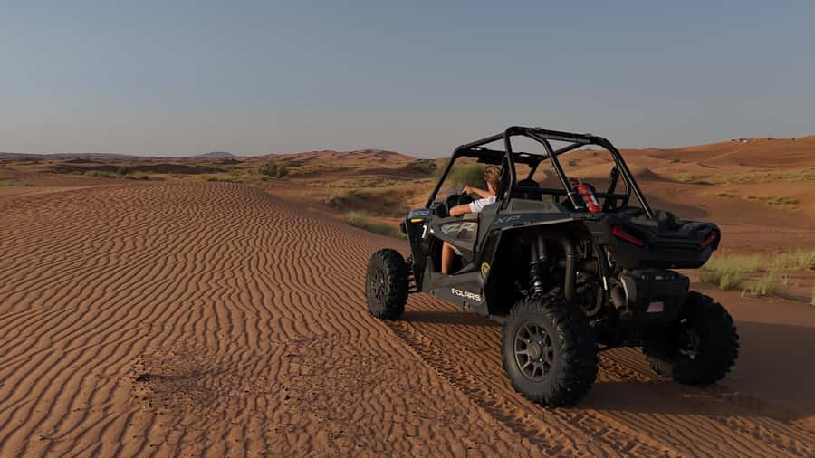Dubai: Private Dune Buggy, Camel Ride, and Sand Boarding! - Red dunes, rock formations, and sunset color