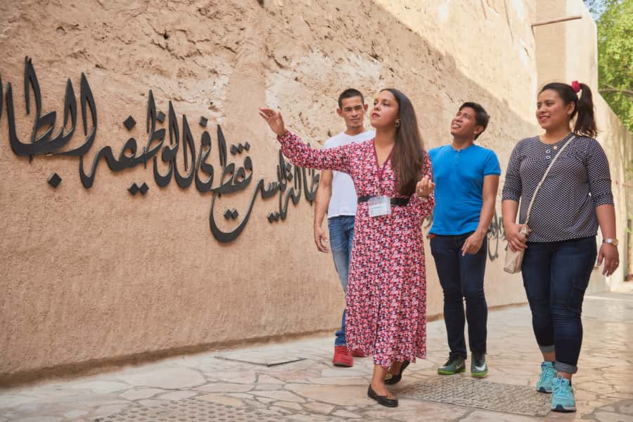Dubai: Private Old Town, Heritage & Souks Walking Tour - Walking from the textile market to Dubai Creek