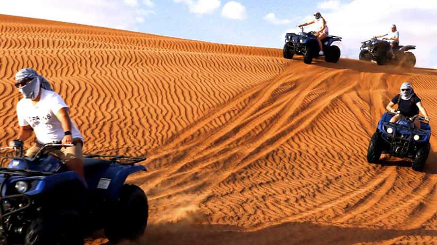 Dubai: Quad & ATV Bike, Red Dune Desert and Safari Adventure - Sandboarding, photos, and a five-minute camel ride