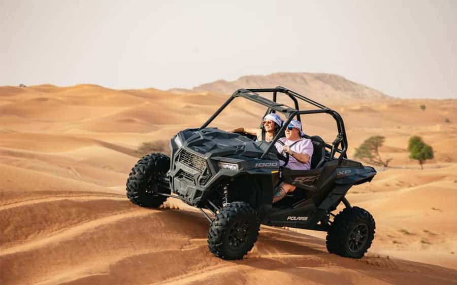 Dubai: Quad Bike, Dune Buggy, and Sandboarding Experience - Red dunes, open sky, and a real desert setting