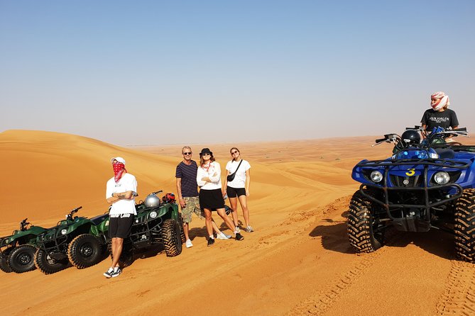 Dubai: Quad Bike Safari, Camels, & Camp with BBQ Dinner - Sandboarding, photos, and a very short camel ride
