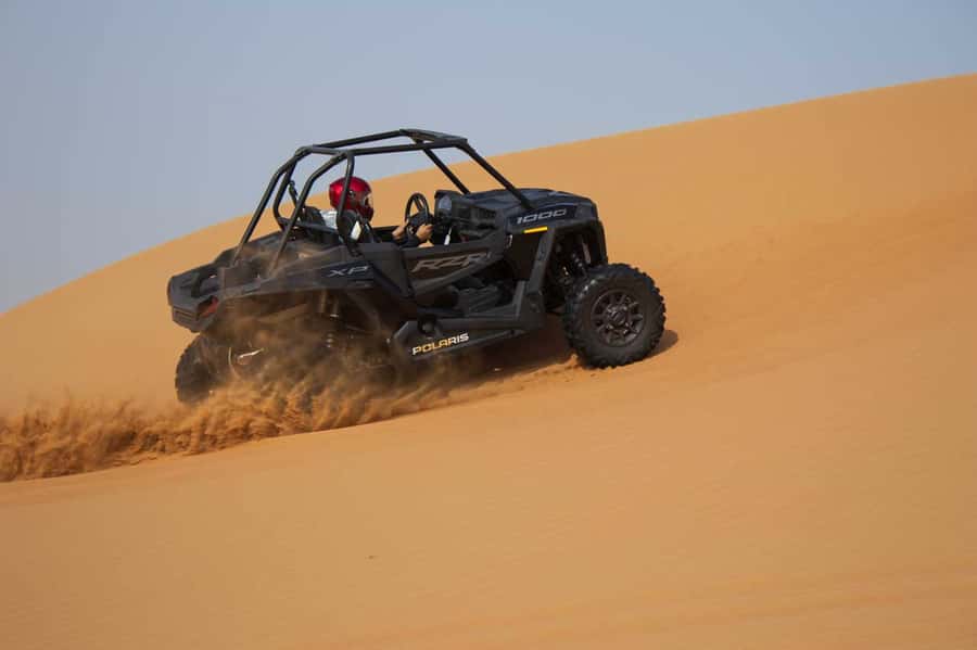 Dubai: Red Dune Desert, Dune Buggy Ride & BBQ Buffet Dinner - Sandboarding, camel time, and the sunset stop