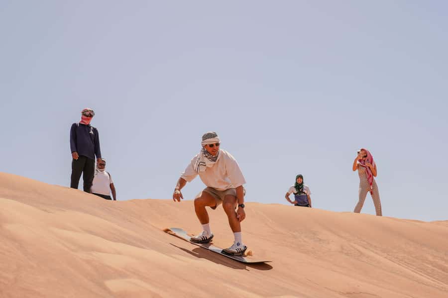 Dubai: Red Dune Desert Safari, Quad Bike, Camels, and BBQ - Camel rides at sunset