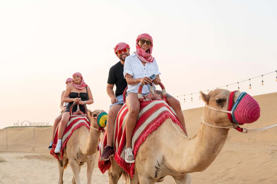 Dubai: Red Dune Desert Safari, Quad Bike, Camels, and BBQ - Dune bashing across steep sand