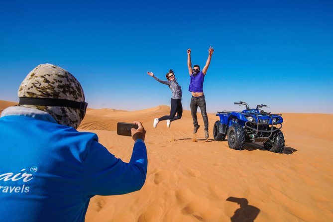 Dubai Red Dunes ATV, Camels, Stargazing & 5<em> BBQ Al Khayma Camp – Key points to know before booking’ /></p>
<ul>
<li><strong>Red dunes near Lahbab:</strong> Expect striking red-orange sand and a guided ATV route with photo stops and sandboarding.</li>
<li><strong>A real six-hour commitment:</strong> Pickup, driving, the ATV session, camp activities, dinner, shows, and the return trip fill most of a day.</li>
<li><strong>Al Khayma Camp is the slow-down point:</strong> Arabic coffee, dates, camel feeding, henna, shisha, falcon photos, and traditional clothing are included.</li>
<li><strong>The evening slot offers more:</strong> Fire performances and stargazing are available at night, while the 11:30 AM departure has lunch but not those evening features.</li>
<li><strong>Guides matter:</strong> Dennis, Asif Foji, Imran Khan, Omar, Youness, Fazil, and Abdul Wahab are among the guides praised for clear instructions, care, photography, and good humor.</li>
<li><strong>Safety is your responsibility:</strong> Riders must be over 14, have basic driving skills, wear the supplied helmet, and cover damage caused during the ATV ride.</li>
</ul>
<h2>Why this Dubai desert safari works</h2>
<p><img width="669" height="446" decoding="async" src=