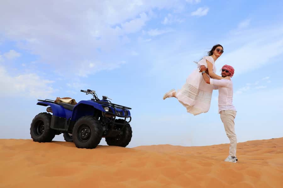Dubai: Red Dunes Quad Bike with Sandboarding, Camels and BBQ - Lahbab’s red dunes are the main event