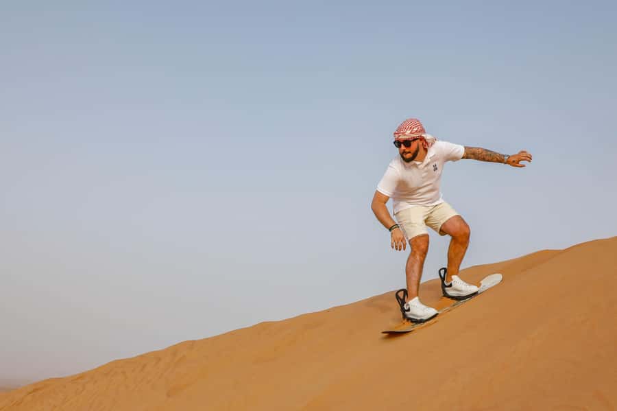 Dubai: Red Dunes Quad Bike with Sandboarding, Camels and BBQ - Sandboarding, photos and the quiet side of the desert