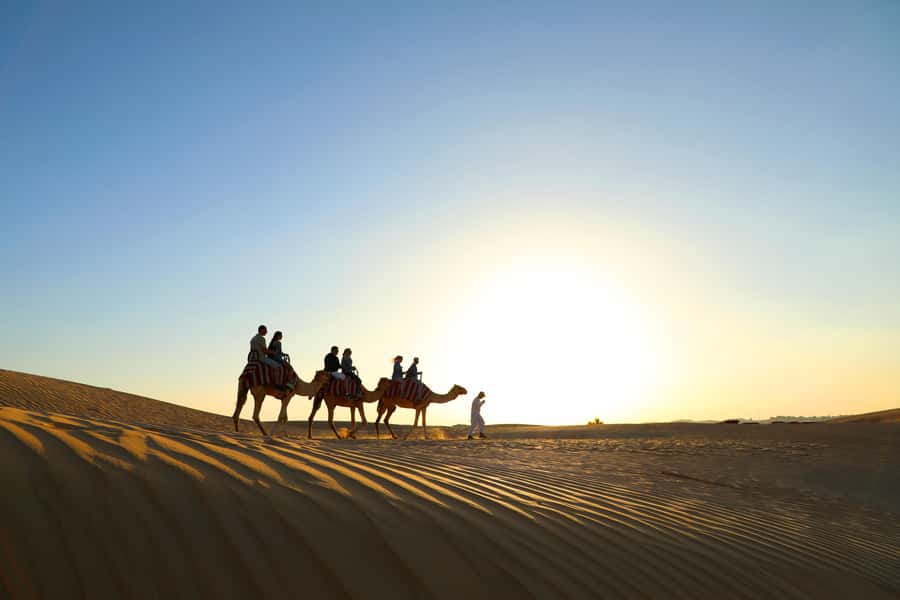 Dubai: Red Dunes Quad Bike with Sandboarding, Camels and BBQ - Fire, horses, falcons and Yola dancing