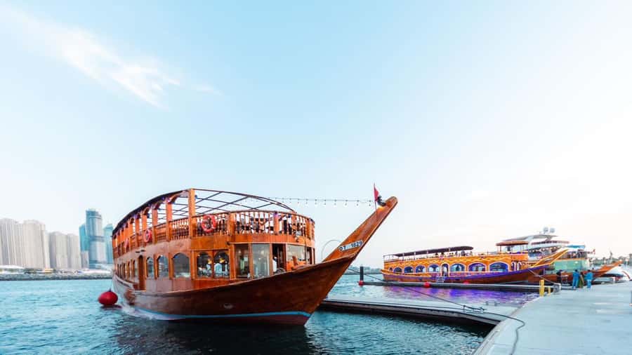 Dubai: Scenic Dhow Cruise with Buffet Dinner and Live Shows - A traditional dhow leaves Dubai Old Village